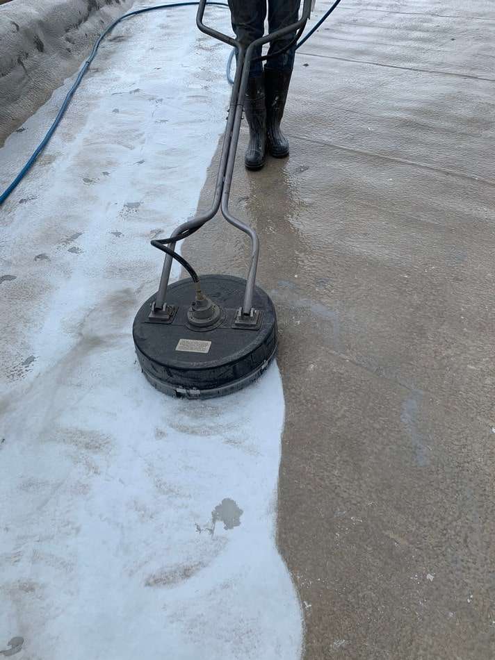 Professional membrane cleaning process ensuring proper surface preparation for restoration coating application
